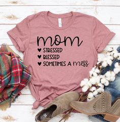 "Mom Stressed Blessed Sometimes A Mess T-shirt, Family T-shirt, Mom T Shirt, Best Gift For Mom, Mother's Day, Bear Mama Shirt, Best Mom Shirt, Mama Tshirt, Gift For Mom, Gift For Mother, Gift For Mama, Funny Shirt, Funny Mom Shirt, Funny Mothers Gift This updated unisex essential fits like a well-loved favorite. Super soft cotton and excellent quality print makes one to fall in love with it over and over again. ------------- Fabrication ------------- 100% Combed ring spun cotton Made by speciall Cotton Slogan T-shirt As Gift, Mother's Day Crew Neck Cotton Shirt, Mother's Day Cotton Slogan Tops, Mother's Day Cotton Crew Neck Shirt, Mother's Day Cotton Shirt With Letter Print, Cotton T-shirt With Letter Print For Mother's Day, Mother's Day Pre-shrunk Cotton T-shirt, Graphic Tee Shirt For Mother's Day Gift, Pre-shrunk Cotton T-shirt For Mother's Day