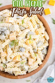 pasta salad in a wooden bowl with text overlay