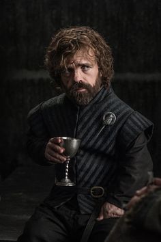 game of thrones'jon arman holding a cup