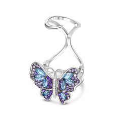 Our gorgeous flying butterfly ring, with its distinctive workmanship, pays tribute to the glamour and elegance of this creature. Through its graceful movement between your fingers, it recreates the fluttering charm of wings and adds unique enchantment to your femininity. Combing beautiful colors and asymmetry, this dazzling piece highlights eight brilliant marquise-cut blue stones, and smaller round stones in purple paved on wings. The multi-colored butterfly, fashioned in fine sterling silver, Luxury White Gold Butterfly Ring, Luxury Silver Butterfly Jewelry, Elegant Adjustable Wing-shaped Jewelry, Elegant Butterfly Ring Gift, Elegant Sterling Silver Rings With Butterfly Charm, Formal Jewelry With Butterfly Clasp, Elegant Rings With Butterfly Charm For Gift, Adjustable Butterfly Ring Fine Jewelry, Elegant Silver Jewelry With Butterfly Print