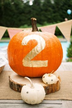 a pumpkin with the number two painted on it