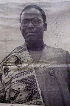 an old newspaper with a man wearing glasses and a scarf on his head, in front of a photo of him