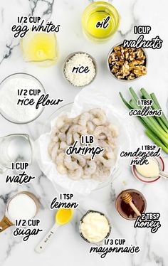 the ingredients to make shrimp salad on a marble counter top