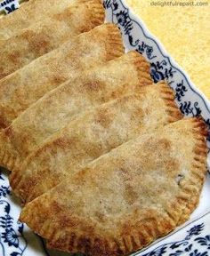 three pastries on a blue and white plate