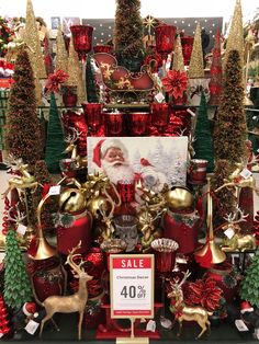 a christmas display with red and gold decorations