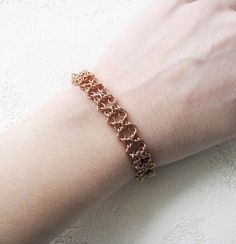 Copper chain bracelet. Womens wide chain bracelet. Chainmail cuff bracelet. Knotted copper bangle. Chainmaille jewelry. Bracelets for women. This is stylish copper chain bracelet for women, original gift for her. This handmade copper cuff lace bracelet is made from solid copper wire using handcrafted chainmaille technique, byzantine weave.  I can change the length of the chain free as you need. Copper is very soft metal. Try not to bend, do not scratch or pull at the small details. Beaded jewellery store in a box, do not let dust, do not drop or wet.  Parcel will go for at least 15-25 days. After sending I'll provide the tracking number and you will be able to track the parcel. Copper Chain Bracelet, Chain Bracelet For Women, Chainmaille Jewelry, Lace Bracelet, Chain Maille Jewelry, Bracelet Knots, Copper Cuff, Copper Chain, Bracelets For Women