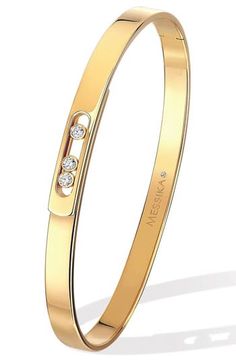 Three brilliant-cut diamonds freely move within the openwork silhouette of a minimalist bangle crafted from 18-karat gold. 1/4" band width Total diamond weight: 0.11ct. Color: G Clarity: VS1 18k gold/diamond Made in France >Diamond Guide Classic Diamond Bangle With Flexible Design, Modern Diamond Bangle With Polished Finish, Modern Luxury Gold-plated Bangle, Adjustable Diamond-accent Cuff Bangle, Yellow Gold Diamond-accented Cuff Bangle, Minimalist Bangle, Diamond Guide, Diamond Bangle, Cartier Love Bracelet