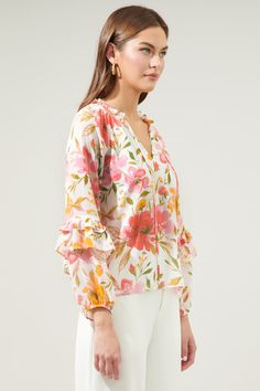 Charming and ethereal. Perfect for sunday brunch or a bridal shower, this top is everything feminine and sweet. It features the watercolor inspired Maldonado print that embodies the Bijou Blouse. A split neckline with tie string details are framed by lengthy balloon sleeves. The bodice maintains a classic fit that can be tucked into your favorite high waisted linen trousers or denim.- Split neckline- Lined- Classic fit- Ruffle details- Color: White Pink MultiSize + Fit - Model is 5'11" and weari Balloon Sleeve Blouse, Long Balloons, Sunday Brunch, Linen Trousers, Unique Designers, Balloon Sleeves, Designer Collection, Ruffle Trim, Pink Floral