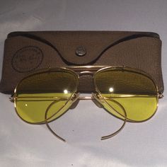 These Authentic Ray Ban Sunglasses Are In Very Good Condition With No Flaws. These Are Rare. No Lowballs. Classic Gold Aviator Sunglasses With Glass Lenses, Vintage Gold Sunglasses With Glass, Yellow Sunglasses With Mirrored Lenses For Formal Occasions, Formal Yellow Sunglasses With Mirrored Lenses, Formal Aviator Sunglasses With Mirrored Glass Lenses, Ray Ban Erika, Purple Sunglasses, Round Ray Bans, Green Sunglasses