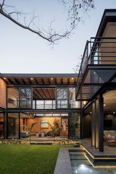 a modern house with an outdoor pool in the yard