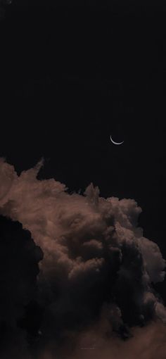 the moon is seen through some clouds in the night sky with no one visible on it