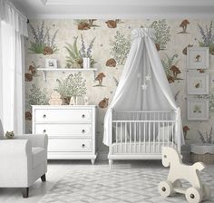 a baby's room with white furniture and decor