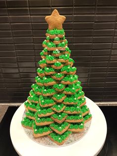 a christmas tree made out of cookies on a plate