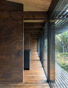 an empty room with wooden floors and walls