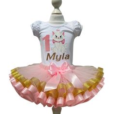 I offer you a beautiful birthday tutu outfit girls. NOTES FOR THE SELLER -Number for personalizing the top. -Name to personalize the vertex. -Need by date. Sleeve for the top - short, long. TOP. The top of it is 100% cotton. Size 3-24 months it is a bodysuit, 2T-10T it is a shirt. (Since it is more handmade always remember the shirt needs to be washed inside out, hand washed and air dried). SKIRT - made of soft tulle, edged at the bottom with a ribbon and decorated with a bow. Tutu is planted on an elastic that allows you to adjust the waist (if possible please include baby measurements (Waist / Length) whenordering one of our beutiful full tutus to ensure a more accurate fit) DELIVERY AND PRODUCTION The production of the outfit takes 1-4 working days, standard delivery up to 9 working day Cute Fitted Tutu Dress For Birthday, White Fitted Tutu Dress For Birthday, Marie Birthday Party, Hello Kitty Shirt, Birthday Tutu Outfit, Beautiful Birthday, Tutu Outfits, Birthday Tutu, Soft Tulle