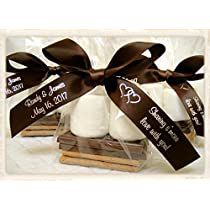 the wedding favors are wrapped in chocolate and white marshmallows with brown ribbon