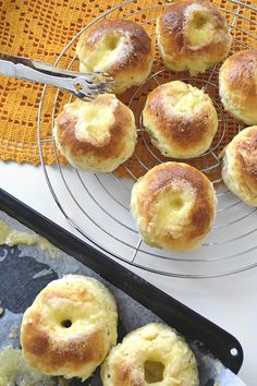 several rolls are cooling on a wire rack