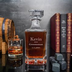 a bottle of personalized whiskey sits on a table next to some books and rocks