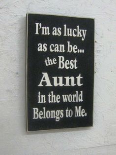 a sign that says i'm as lucky as can be the best aunt in the world belongs to me