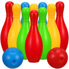 colorful plastic bowling pins and balls on a white background