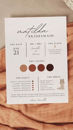 the wedding program is laid out on top of an orange sheeted bed with brown linens