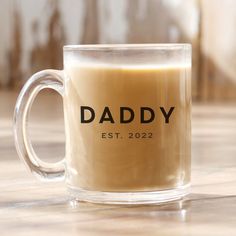 a coffee mug with the word daddy on it