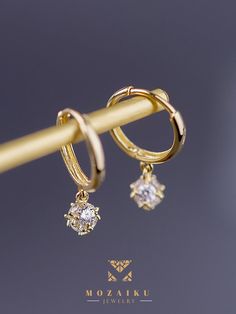 Diamond pavé creates a perfect droplet for these buckle earrings, which are the signature collection of Mozaiku. Now you can choose in either 14K or 9K gold Specification: Precious Metal Condition : 9K Gold / 14K Gold Purity : 14k yellow gold, 9K yellow gold Stone : Zircon Custom made Classic Gold Diamond Drop Earrings, Classic Dangle Huggie Earrings With Diamond Accents, Elegant Silver 14k Gold Filled Huggie Earrings, Gold Huggie Earrings With Diamond Accents For Formal, Luxury Gold Drop Diamond Earrings, Gold Huggie Diamond Earrings For Formal Occasions, Gold Tarnish Resistant Drop Diamond Earrings, Gold Huggie Earrings With Diamond Accents In 14k Gold, Formal Fine Jewelry Huggie Dangle Earrings