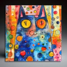 a colorful painting with a cat's face on it