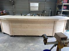 a large wooden counter sitting inside of a garage