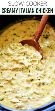 slow cooker creamy italian chicken in a blue bowl with a wooden spoon