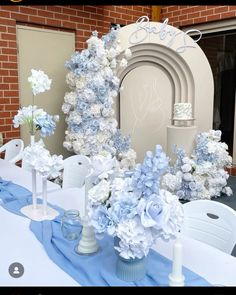 a table topped with blue and white flowers