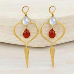 This dainty Earrings use genuine Moonstone and high quality silver with 18k gold plated. The unique shape and bright red drop are suitable for an casual look, evening look and for a holiday. The Earrings will be a good Christmas, anniversary, wedding or birthday gift for mom, wife, girlfriend, sister or daughter. Upgrade your jewelry collection with this dainty high-quality earrings, and be ready to receive compliments all the time! * Material: Natural Moonstone + High Quality Silver + 18K Gold Red Gemstone Gold-plated Earrings, Red Gemstone Gold Plated Earrings, Modern Moonstone Earrings As Gift, Ruby Stone, Gift For Wife, Dainty Earrings, Mom Birthday Gift, Gold Design, Surprise Gifts