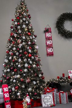 a decorated christmas tree with presents under it