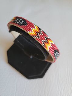 "I use size 15 seed beads. The length is 6\" and the width is 3/8\".Product is an adjustable cuff bracelet with a pigskin covering." Beautiful Beadwork, Beaded Cuff Bracelet, Native American Beading, Beaded Cuff, Unique Bracelets, Pig Skin, Photo Bracelet, Bracelet Designs, Beaded Bracelet