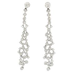 18K White Gold Earrings with Diamonds 18K White Gold - 9.04 GM 236 Diamonds - 1.89 CT Crafted with exquisite attention to detail, these tassel-shaped diamond earrings from Althoff Jewelry are the perfect statement piece for any occasion. The expertly cut diamonds are arranged in a cascading pattern, creating a mesmerizing effect that is sure to turn heads. Whether you're attending a black-tie event or simply want to add a touch of glamour to your everyday look, these earrings are the perfect choice. The unique design and unparalleled craftsmanship make them a true work of art, and they are sure to become a treasured part of your jewelry collection for years to come. White Gold Drop Earrings, Black Tie Event, Diamond Drop Earrings, White Gold Earrings, Gold Drop Earrings, Black Tie, Diamond White, Everyday Look, Diamond Jewelry