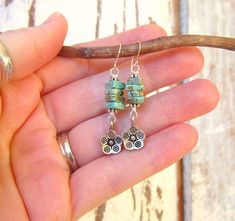 "These genuine mint green turquoise stack dangle earrings are so cute. Four natural turquoiae stacked stones are accented with Bail sterling silver spacers on top and bottom. Adorable little Thai silver flower charms dangle from the bottom. They measure 1 1/2\" long from the top of the sterling silver earwires. Lightweight and comfortable for all day wear. See a matching BRACELET here: https://www.etsy.com/listing/216118921/triple-strand-turquoise-braceletchunky?ref=shop_home_active_1 All my jew Turquoise Bohemian Flower Earrings For Gift, Adjustable Turquoise Flower Earrings Gift, Bohemian Turquoise Flower Earrings Nickel Free, Turquoise Flower Earrings Gift, Turquoise Nickel-free Flower Earrings For Jewelry Making, Nickel-free Turquoise Drop Flower Earrings, Turquoise Dangle Flower Earrings With Ear Wire, Turquoise Dangle Flower Earrings, Cute Hypoallergenic Turquoise Jewelry