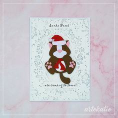 a card with a monkey wearing a santa hat