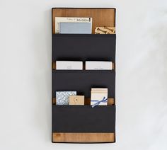 a wall mounted shelf with several items on it