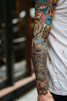 a man with a colorful tattoo on his arm