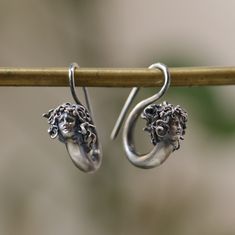 Medusa Earring 925 Silver, Witch Medusa Jewelry, Snake Jewelry,, Handmade Earring, Mythological Jewelry, Greek God, Earring Antique Silver This is made with 925 Silver material. Let's not forget that it is handmade. There may be minor differences. It can be made with other materials. You can send a message. If you have any questions, please feel free to contact me, we are happy to help. Your jewelry will be packed in a luxury jewelry box ready to be given as a special gift. Visit my shop to view Symbolic Silver Sterling Silver Plug Earrings, Symbolic Silver Earrings With Ear Wire, Symbolic Round Earrings, Silver Symbolic Earrings For Jewelry Making, Symbolic Sterling Silver Pierced Earrings, Handmade Sterling Silver Round Plug Earrings, Symbolic Sterling Silver Drop Earrings, Unique White Gold Pierced Earrings, Silver Handmade Symbolic Earrings