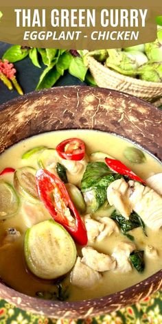 thai green curry soup in a wooden bowl with red peppers and zucchini on the side