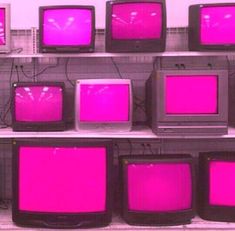 pink televisions are stacked on top of each other