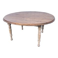 an oval wooden table with two legs and a round top, on a white background