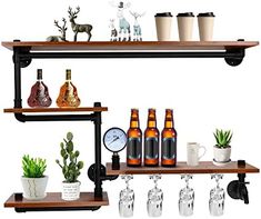 three shelves with bottles, cups and plants on top of each shelf in front of a clock