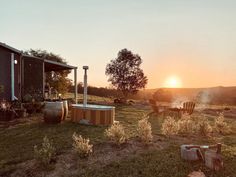 a hot tub sitting in the middle of a field