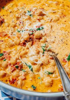 a bowl filled with pasta and cheese on top of a table