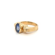 Oval cut Blue Sapphire mounted in a half bezel yellow gold setting. The Sapphire center stone bears excellent luster and a vibrant deep blue color hue. The art deco-inspired ring setting is made in 14k solid gold.   Ring Details: ✔ Metal: 14k gold  ✔ Ring Size: 7 ✔ Sapphire Weight: 2 carats (approx.) ✔ Sapphire Cut: Oval modified brilliant  ✔ Sapphire Dimensions: 8.4mm x 5.7mm x 5.5mm ✔ Ring Weight: 6.3 grams Formal Sapphire Ring With Bezel Setting And Oval Cabochon, Classic Yellow Gold Sapphire Ring Oval Cabochon, Formal 14k Gold Sapphire Ring With Oval Cabochon, Art Deco Sapphire Ring With Polished Finish, Blue Oval Sapphire Ring In Art Deco Style, Classic Blue Sapphire Ring With Oval Cabochon, Elegant Sapphire Oval Signet Ring, Art Deco Blue Oval Sapphire Ring, Classic 14k Gold Sapphire Oval Cabochon Ring