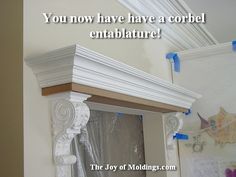 there is a mirror with some tape on it and the words you now have a corbel entablature