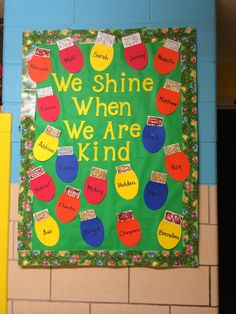 a bulletin board that says we shine when we are kind