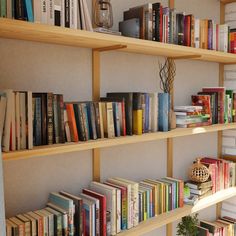 a bookshelf filled with lots of different colored books